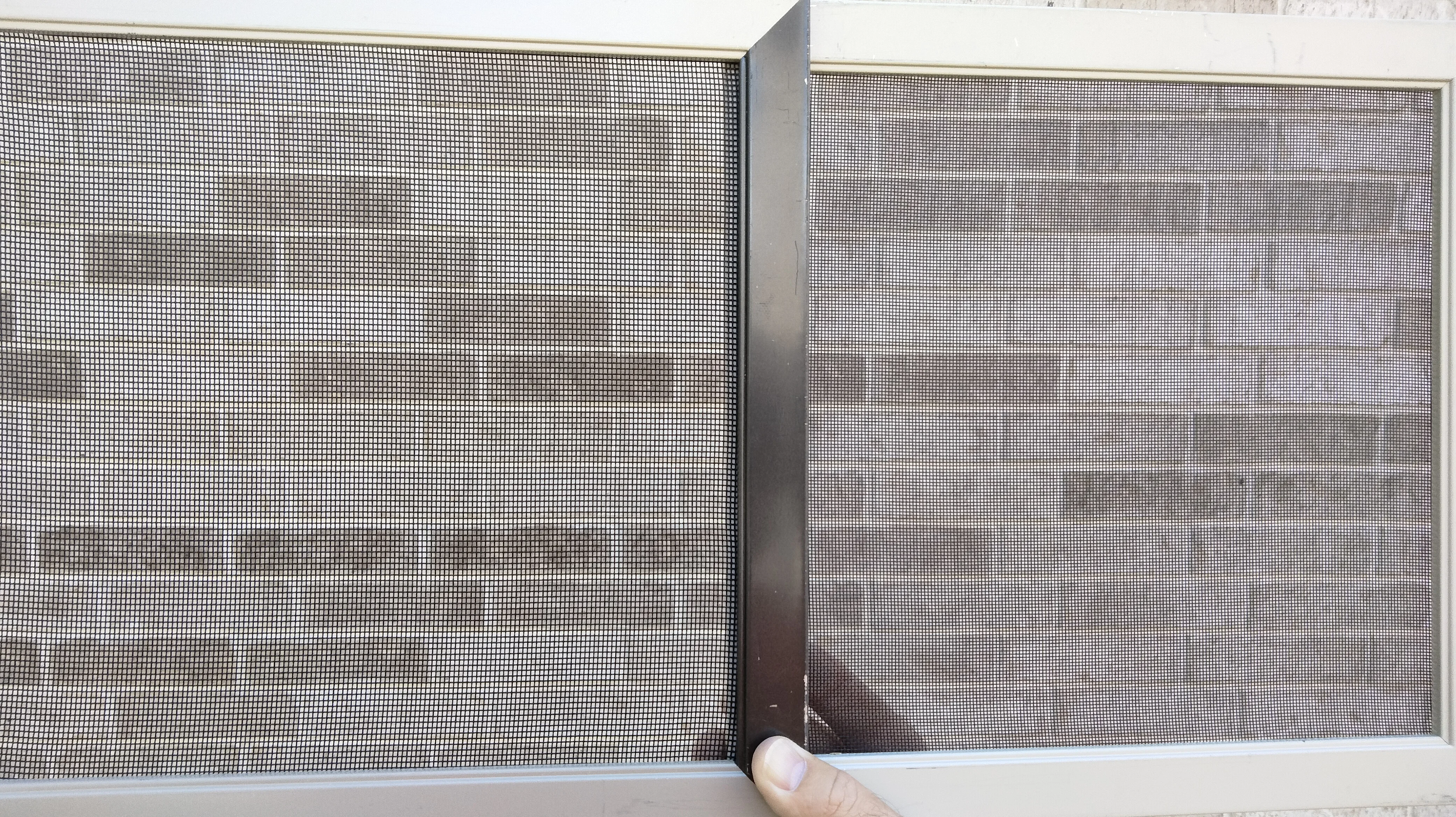 Two aluminum-framed patio screens showing standard mesh and no-see-um mesh side by side